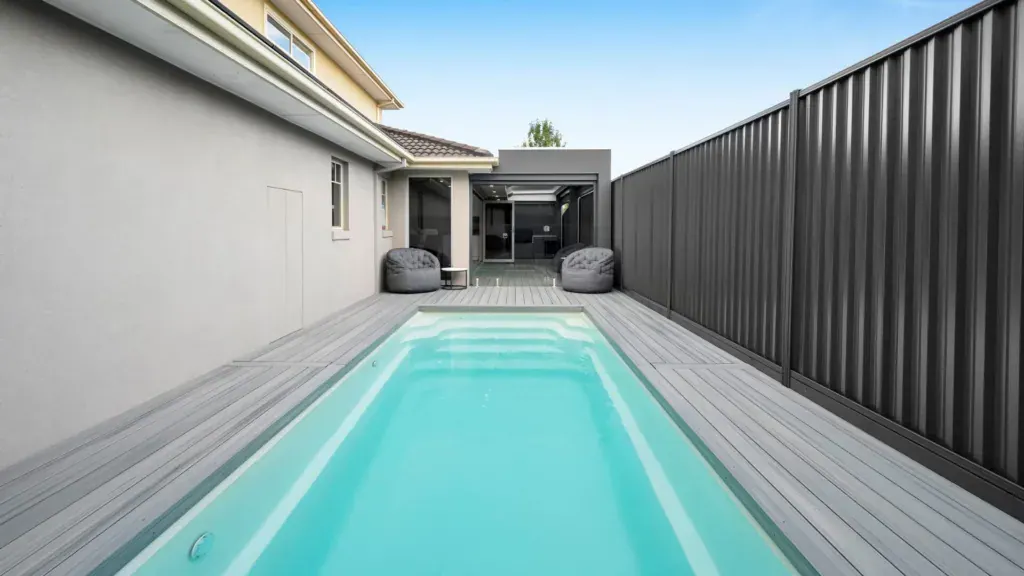 Modern low-maintenance backyard fibreglass pool