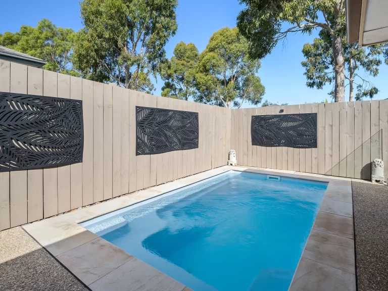 Fibreglass pool in backyard